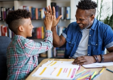 Father helping son with homework
